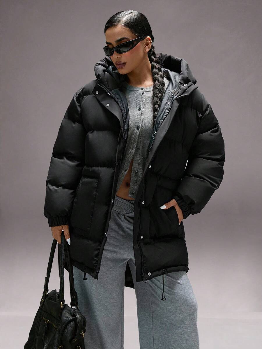 Oversize vinterjakke dame i pufferstil med hætte, store lommer og trykknapper, Sort, billede 5
