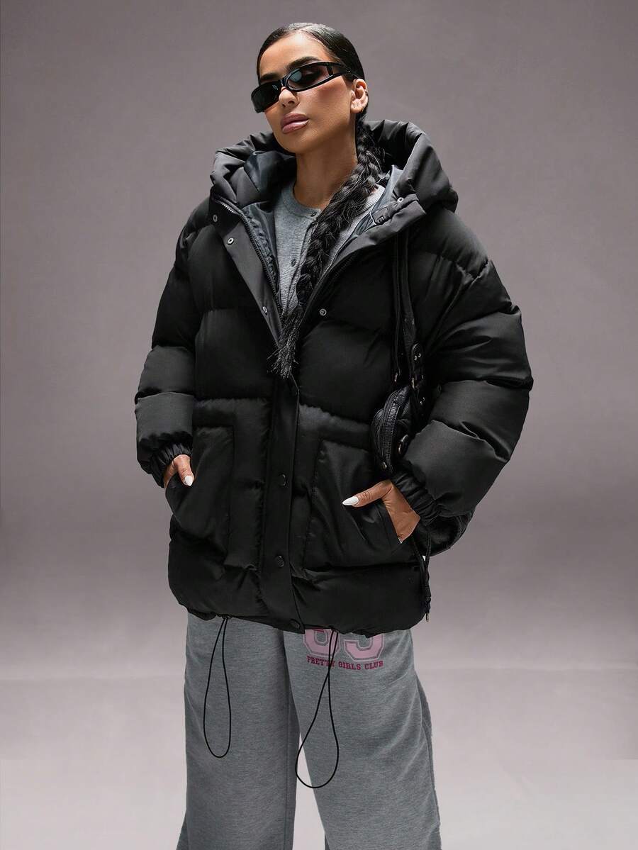 Oversize vinterjakke dame i pufferstil med hætte, store lommer og trykknapper, Sort, billede 6