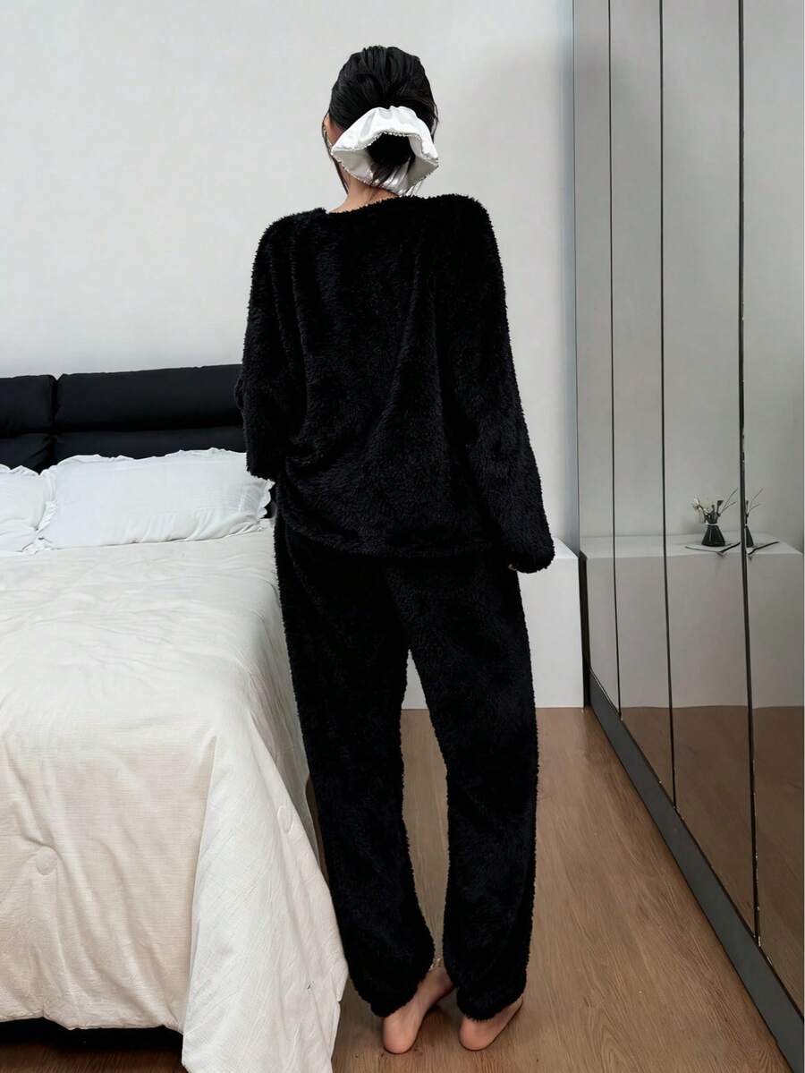 Pyjamas dame i tyk og blød fleece, løs top med rund hals og bukser med elastik, Sort, billede 2